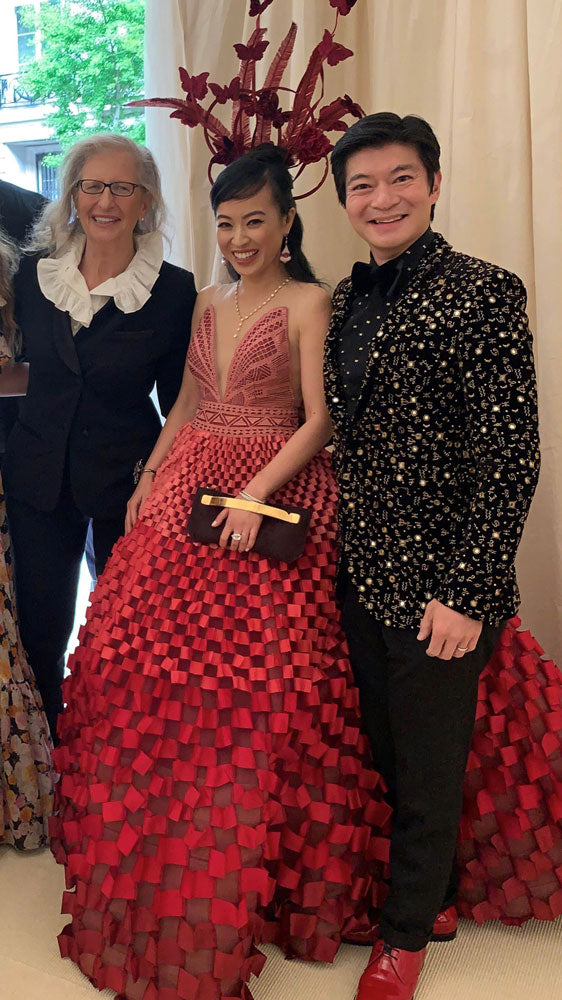 Coral and husband posing with Annie Leibovitz