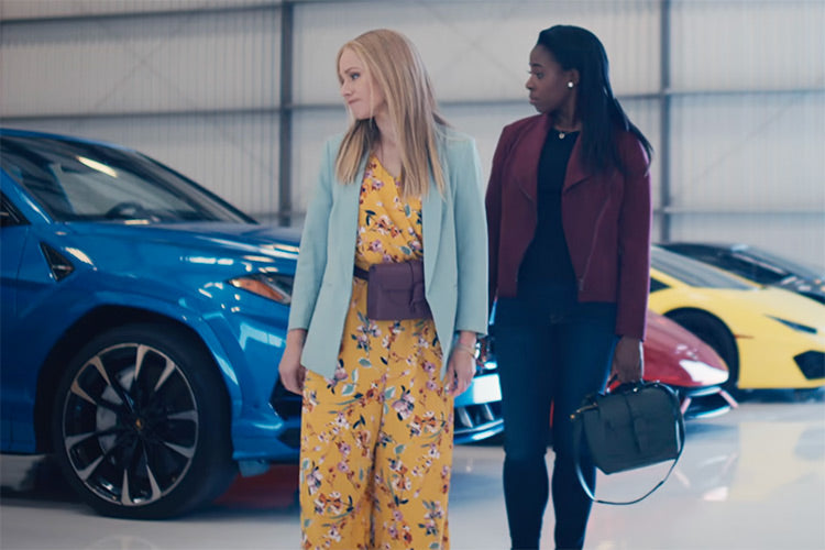 kristin bell and kirby howell-baptiste wearing senreve bags looking at luxury cars