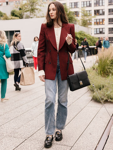 straight leg jeans and a black sleek shoulder bag