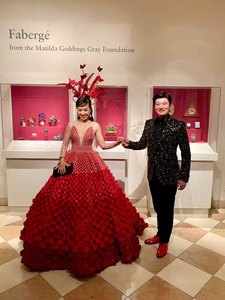 Coral and husband posing in front of Faberge exhibit