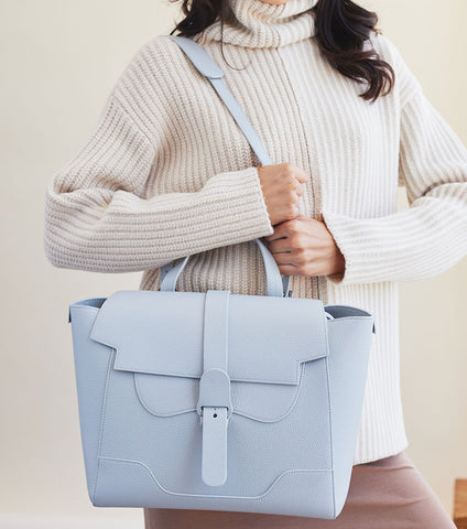 light blue designer bag with pockets