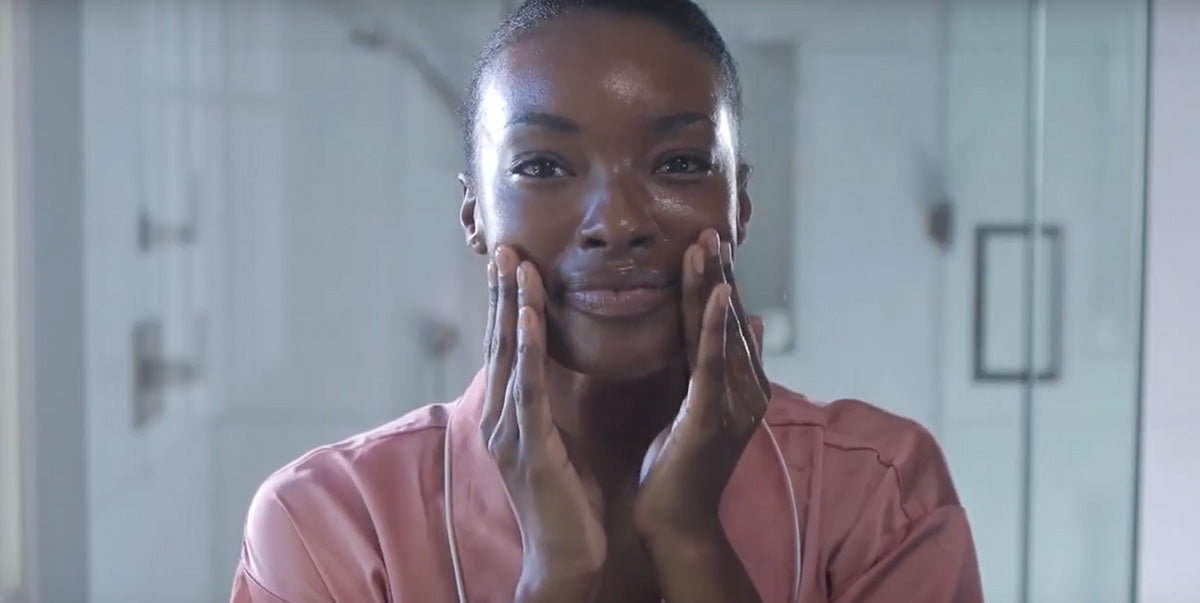 Woman using cleansing oil