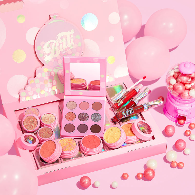 Bitti x ColourPop PR Box Collection Includes the Candy Button Palette, Bitti Pop Super Shock Shadow Foursome, Sweetener Liquid Lip Trio, and all 4 Super Shock Cheeks stylized photo with gum balls.