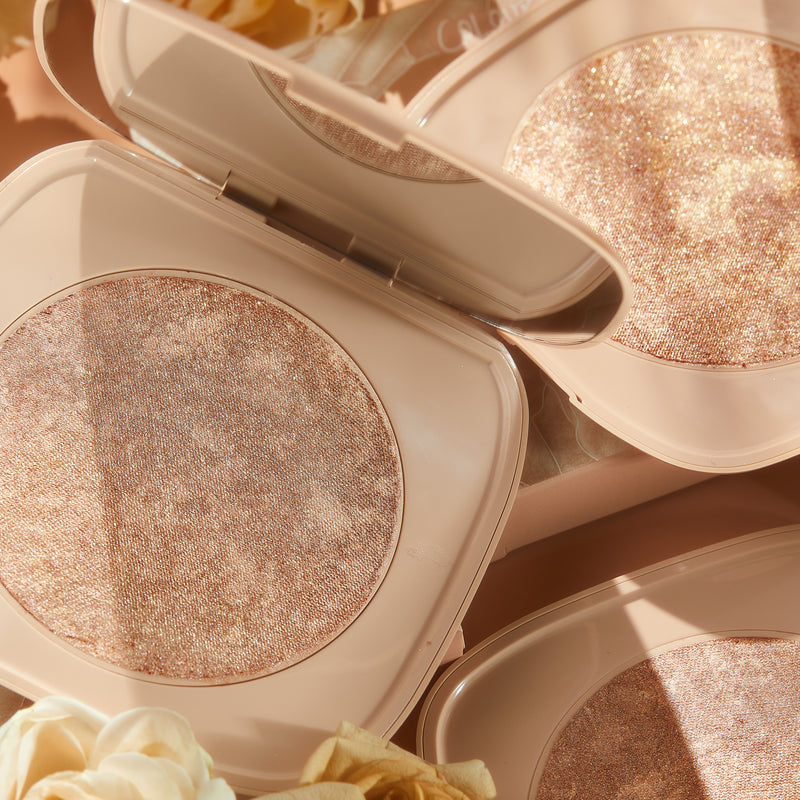 The Real Thing marbled warm bronze with golden pinpoints Super Shock Highlighter compact