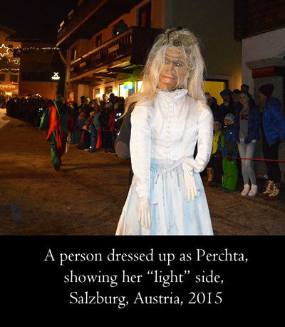 A person dressed up as Perchta, showing her light side. Salzburg, Austria, 2015