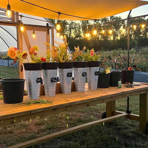 Harvest table arranged with tools for making bouqets on a flower farm