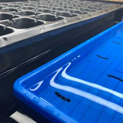 Ebb and Flow flood tray with black cell tray and blue 1020 microgreen tray.