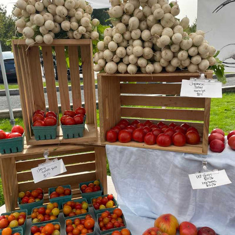 farm stand with produce stacked