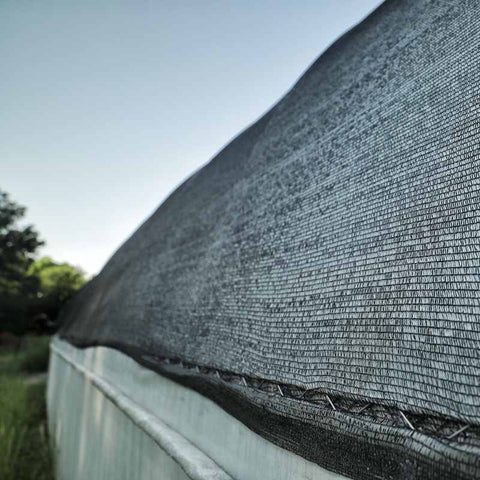 black shade cloth on hoop house greenhouse