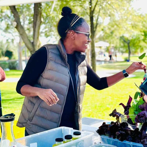 Urban farmer avrile remy at a farmer's market