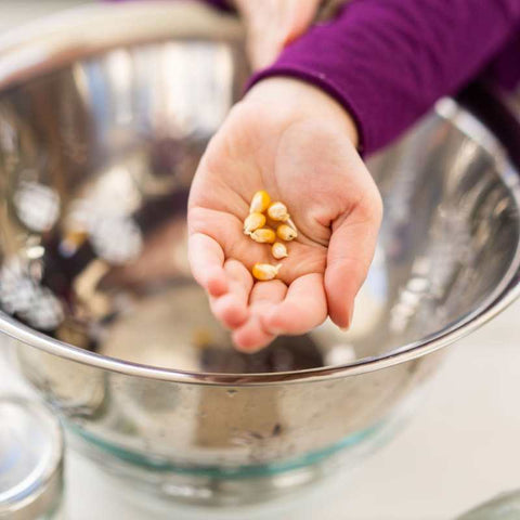 Hand and colendar with popcorn