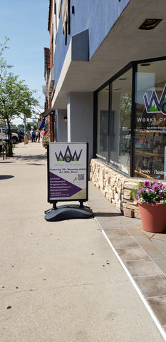 Looking South from the corner of Grand and 2nd Avenues, our sidewalk sign shares some information of our store