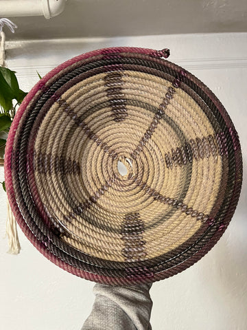 Patterned basket from repurposed Cowboy rope, perhaps used in a round up or rodeo.