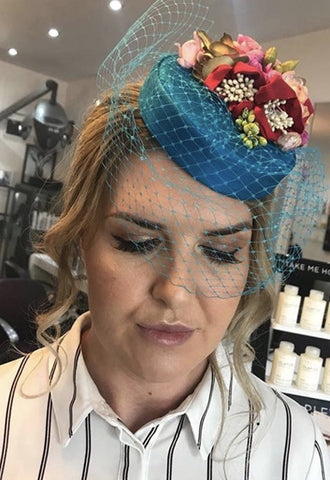 Jen wearing her teal silk Coquette pillbox hat with pink and red flowers