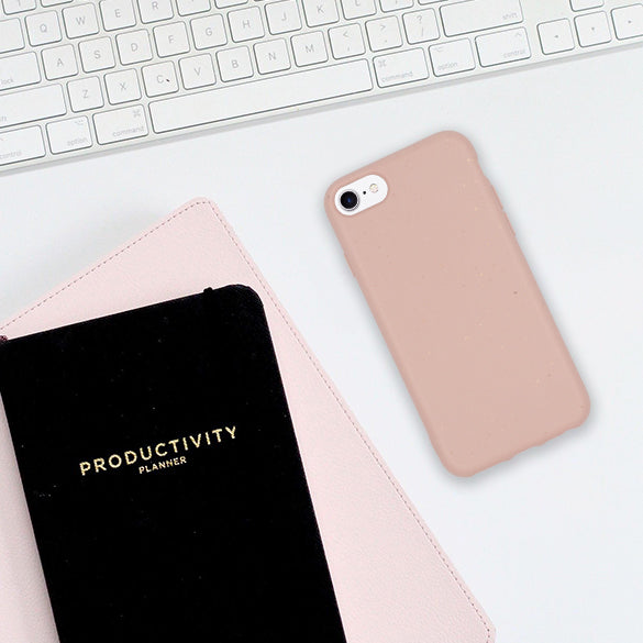 Flatlay of Compostable Pastel Pink Phone Case in the Office