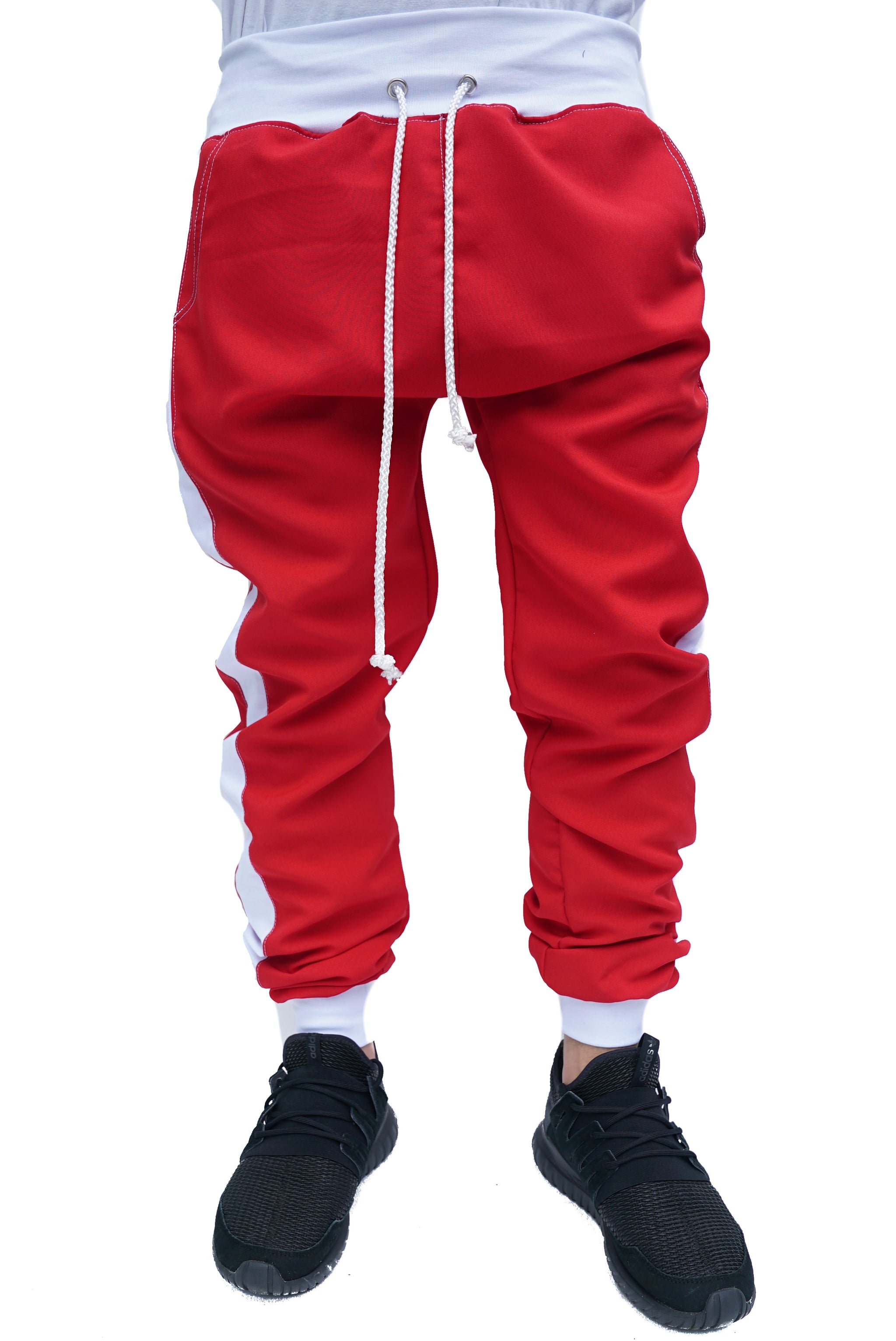 white track pants with red stripe