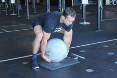 training with atlas stones is a similar 'wrist flexed' position as false grip.