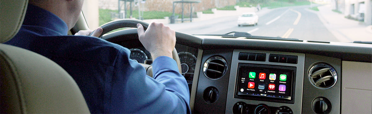 Man Driving in a Car with a Pioneer Apple CarPlay Radio
