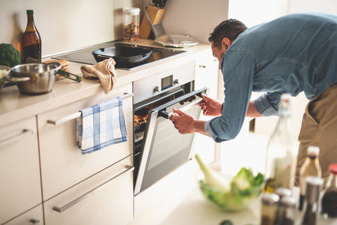 Man opening modern oven