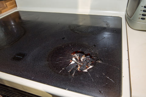 Closeup of cracked glass cooktop stove