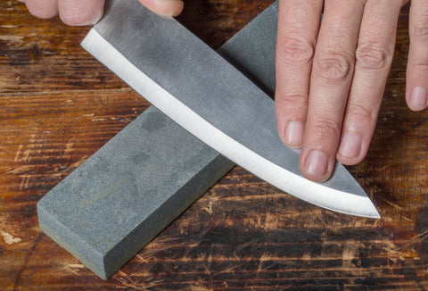 image of knife on sharpening stone