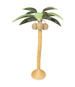 A large bamboo palm tree floor lamp with bulbs in the three coconuts, with green rattan leaves