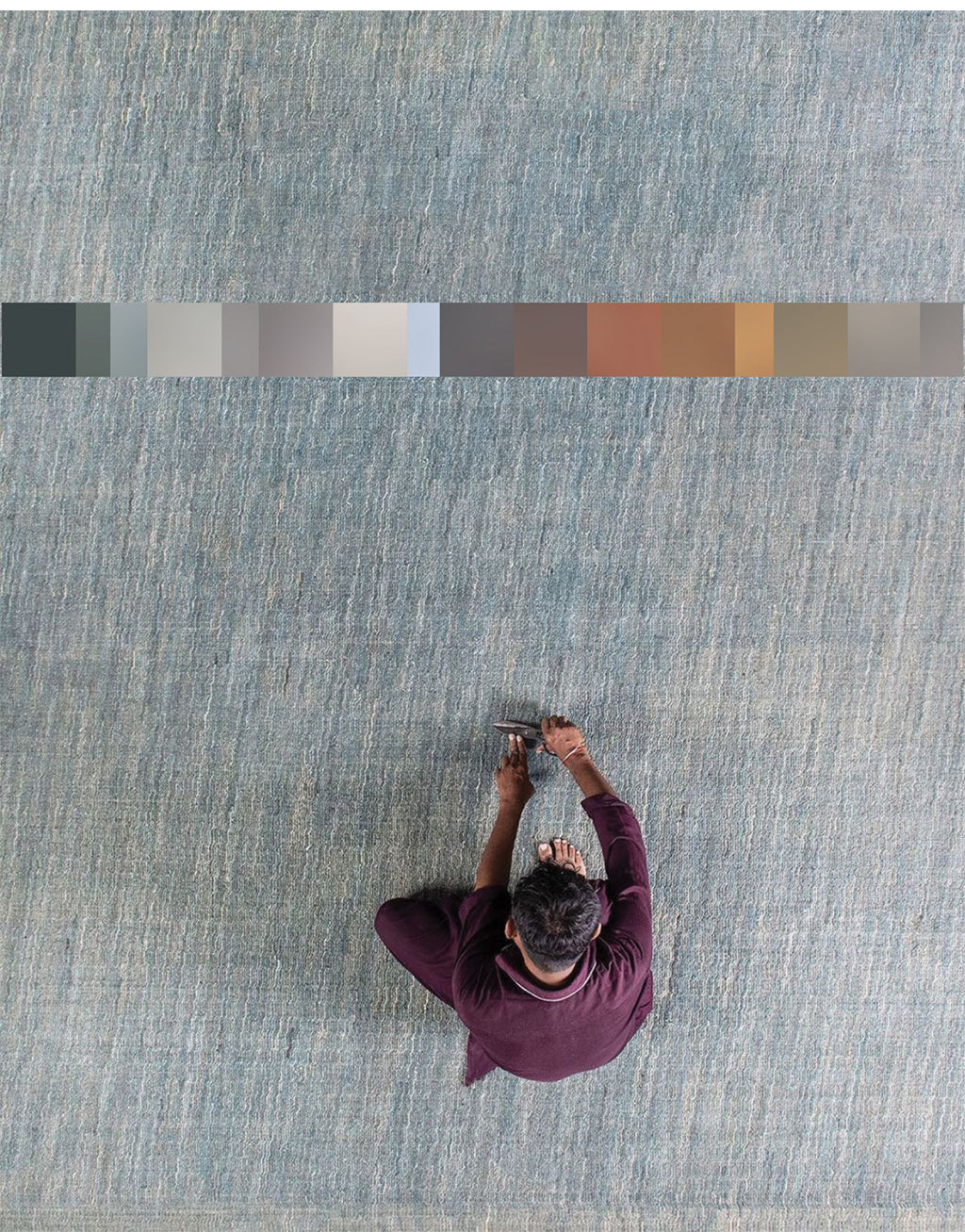 Worker finishes Avita rug by Battilossi