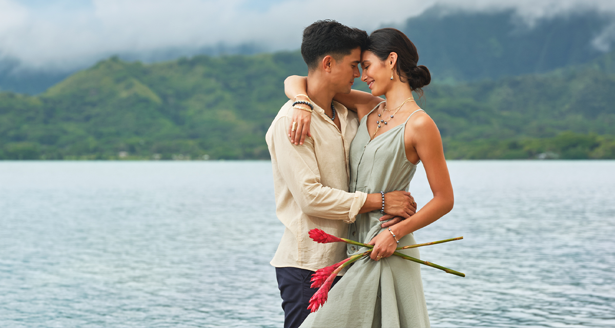 Couple Embrace on Beach - Maui Divers Jewelry