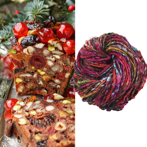 Hearty fruit cake on the left, with a nest of multicolored banana fiber silk yarn on the right.