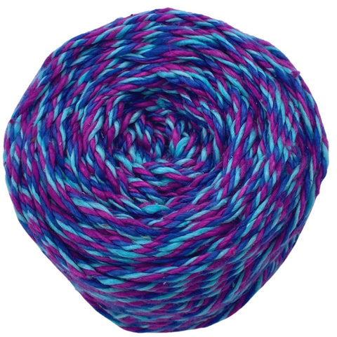 A closeup image of a cake of purple, pink, and blue 3-ply triple twist weight silk yarn on a white background.