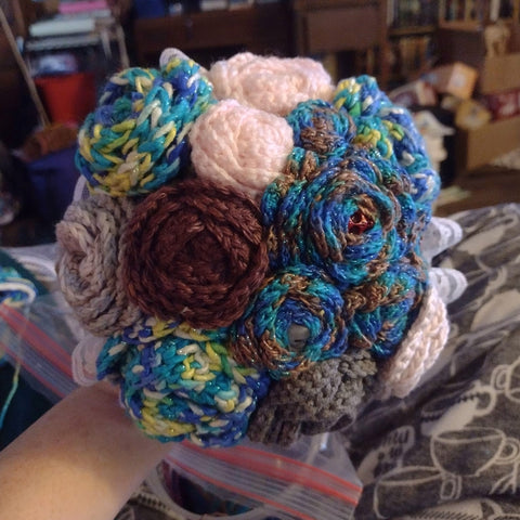 A bouquet of multicolored yarn flowers