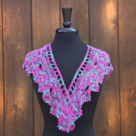 Intermediate crochet shawl pattern from Darn Good Yarn with a deep V-neck line.