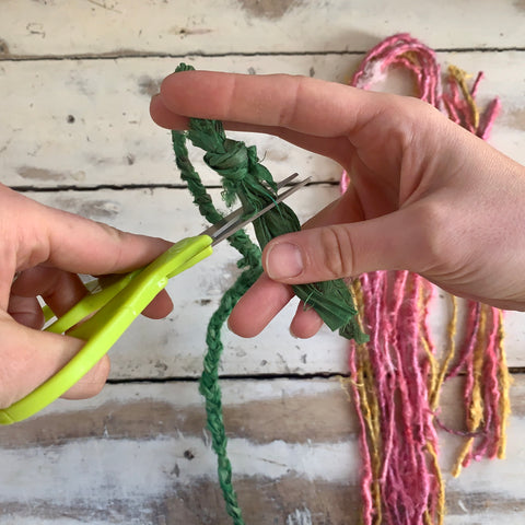 Trimming Sari Silk Ribbon to make even at ends