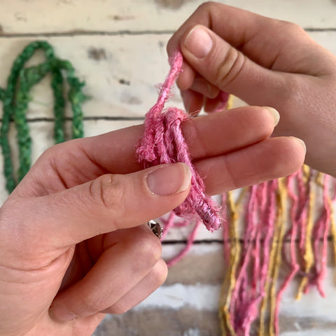 Creating small loops of yarn using index and middle fingers