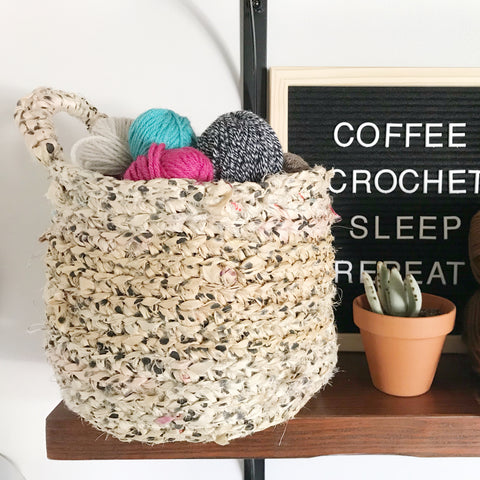 Hayden Hanging Basket sitting on a wooden shelf next to a potted cactus and black letterboard