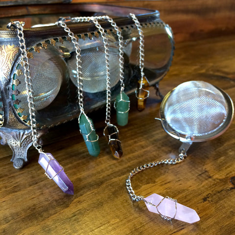 6 loose leaf tea infusers sitting on a wooden table