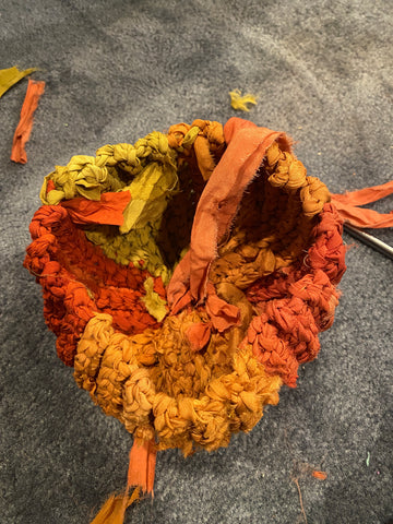 The braided pumpkin being sewn shut, ready to be stuffed.