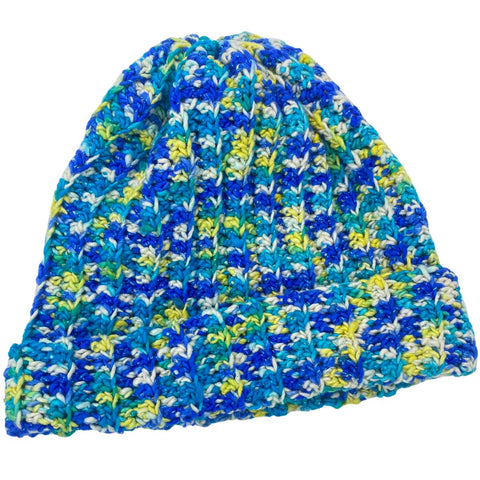 A beanie made from ribbed blue, yellow, and white worsted weight silk yarn.
