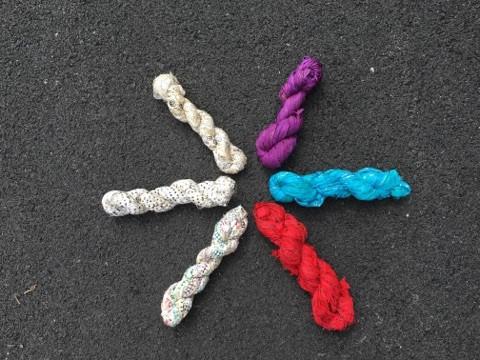 multiple yarn skeins in the ground in the form of a star