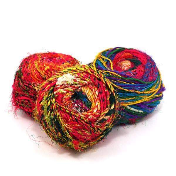 3 cakes of Spice Market Yarn on a white background