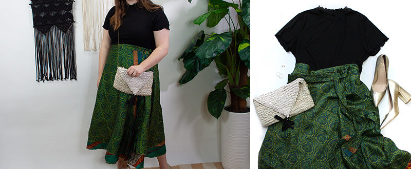 women with shiny green sari wrap skirt with black lettuce edge shirt and recycled sari bag