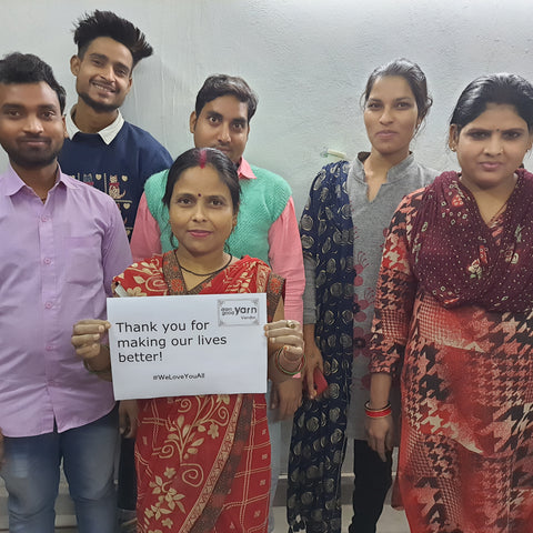 Soniya, to the back right of the picture, is posing for a group picture with the rest of the team at her co-op