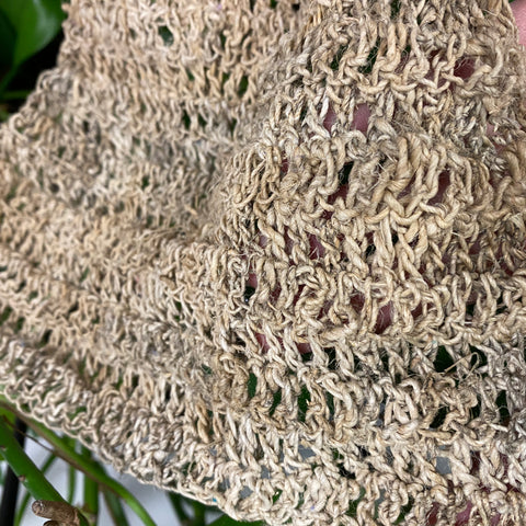 An up close image of the hammock, made out of single ply hemp yarn so the texture can be seen