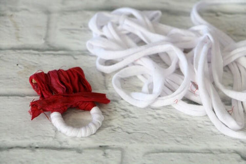 handmade snowman head sitting on a white surface