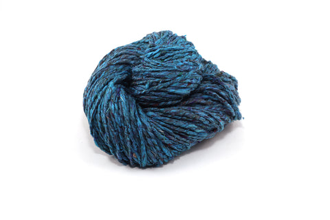 Speckled Tweed Recycled Silk Yarn
-Oceanic Blue, a soft silky teal blue yarn.