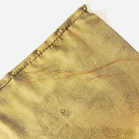 Close-up photo of pinned and sewn sari fabric.