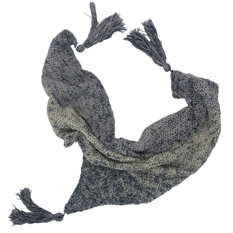 A grey triangular scarf curled up on a white background!