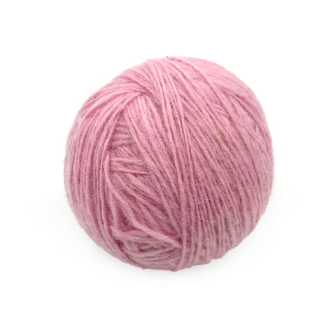 Yak Wool Yarn from Nepal- Pink Candy, a ball of pastel pink wool yarn.