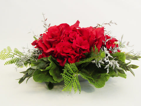 Red roses and geraniums centerpiece - Designs by Ginny