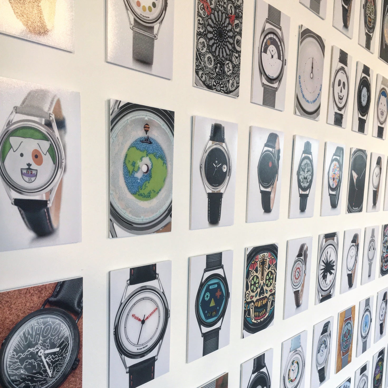 Display of watches covering the wall of the pop up shop
